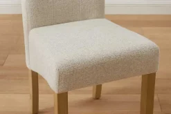 Design Stuhl CASA beige Bouclé Tweed Soft Massivholzbeine Zierknöpfe und Nackenrolle