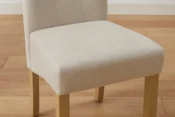 Design Stuhl CASA beige Strukturstoff Massivholzbeine mit Zierknöpfen und Nackenrolle