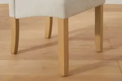 Design Stuhl CASA beige Strukturstoff Massivholzbeine mit Zierknöpfen und Nackenrolle