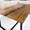 Massiver Couchtisch AMAZONAS 110cm Mangoholz Metall schwarz Baumkante Honey Finish