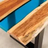 Massiver Couchtisch LIQUID 110cm braun Akazienholz Baumkante schwarz Eisen blau