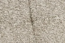 Moderner Hocker SCANDINAVIA champagner greige Bouclé schwarze Metallbeine Fußhocker